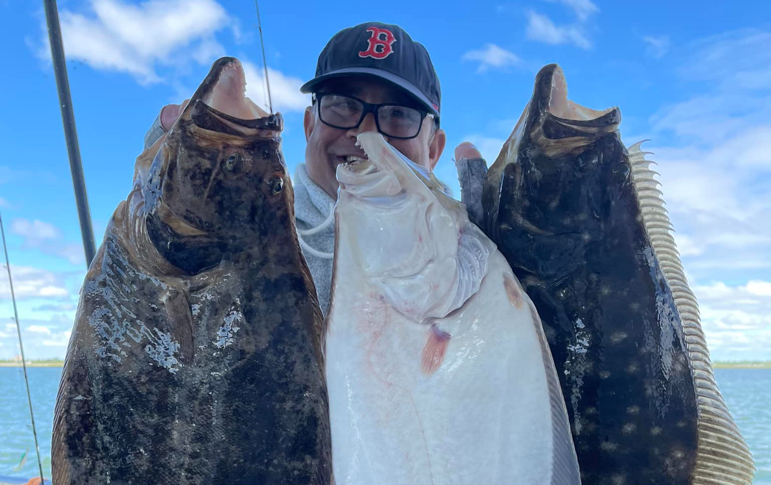 Anglers with striped bass catch from Super Hawk Fishing Charter Point Lookout Long Island