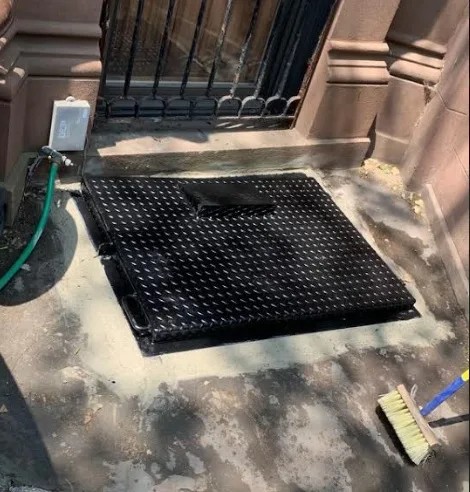 Spring steel inspection of sidewalk cellar door by Steel Masters NYC in Brooklyn