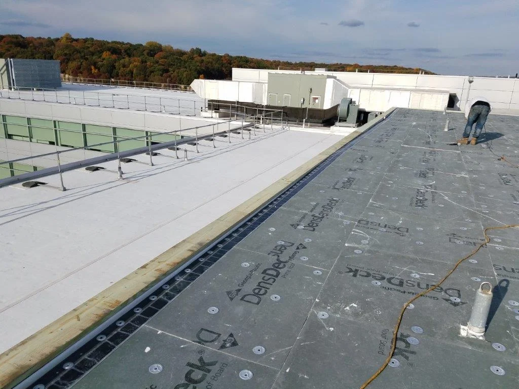 Commercial roofing permit work in Babylon, NY — All-Star Roofing team preparing flat roof documentation for Suffolk County town building department
